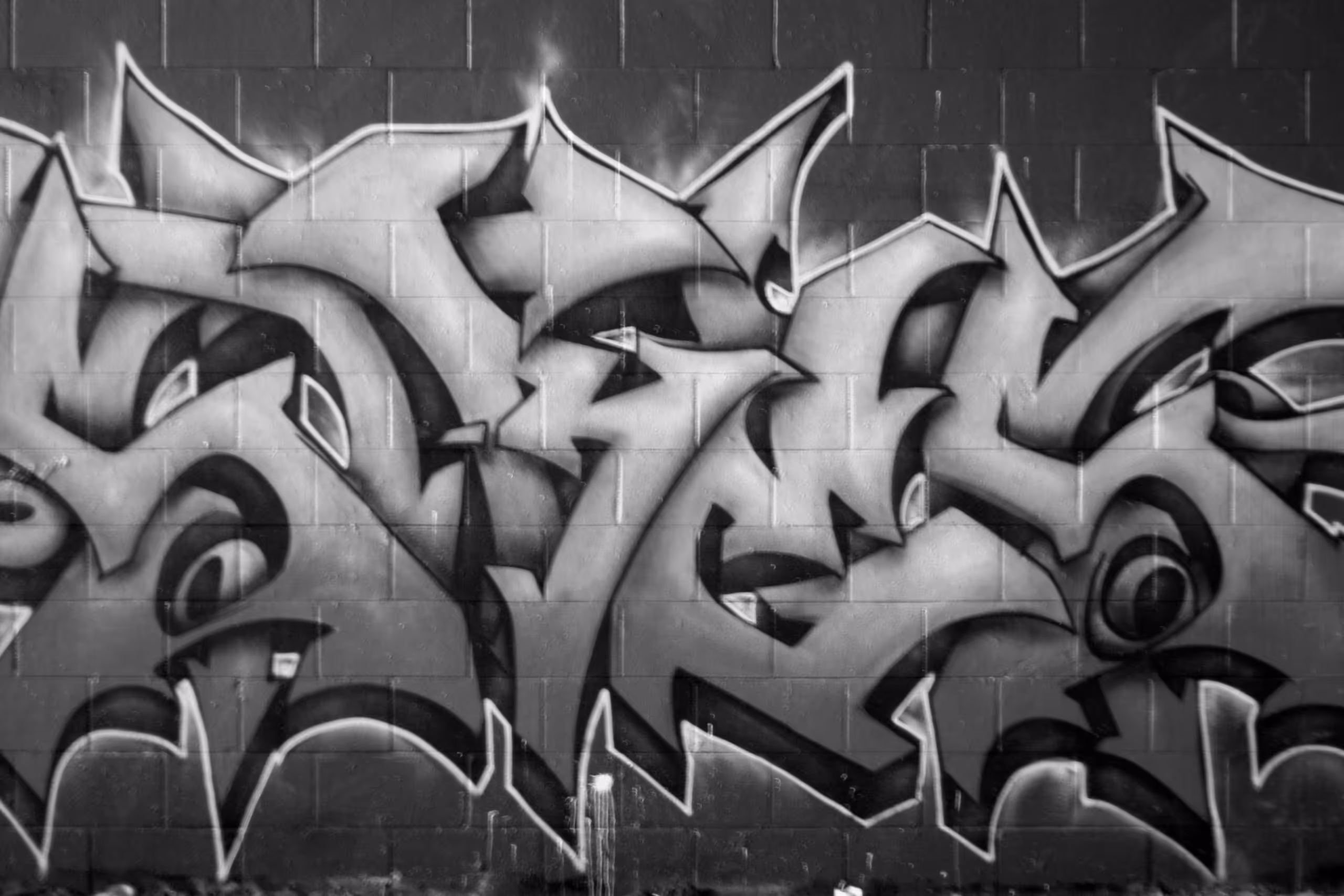 Art therapy for social justice with street graffiti spray-painted on a wall