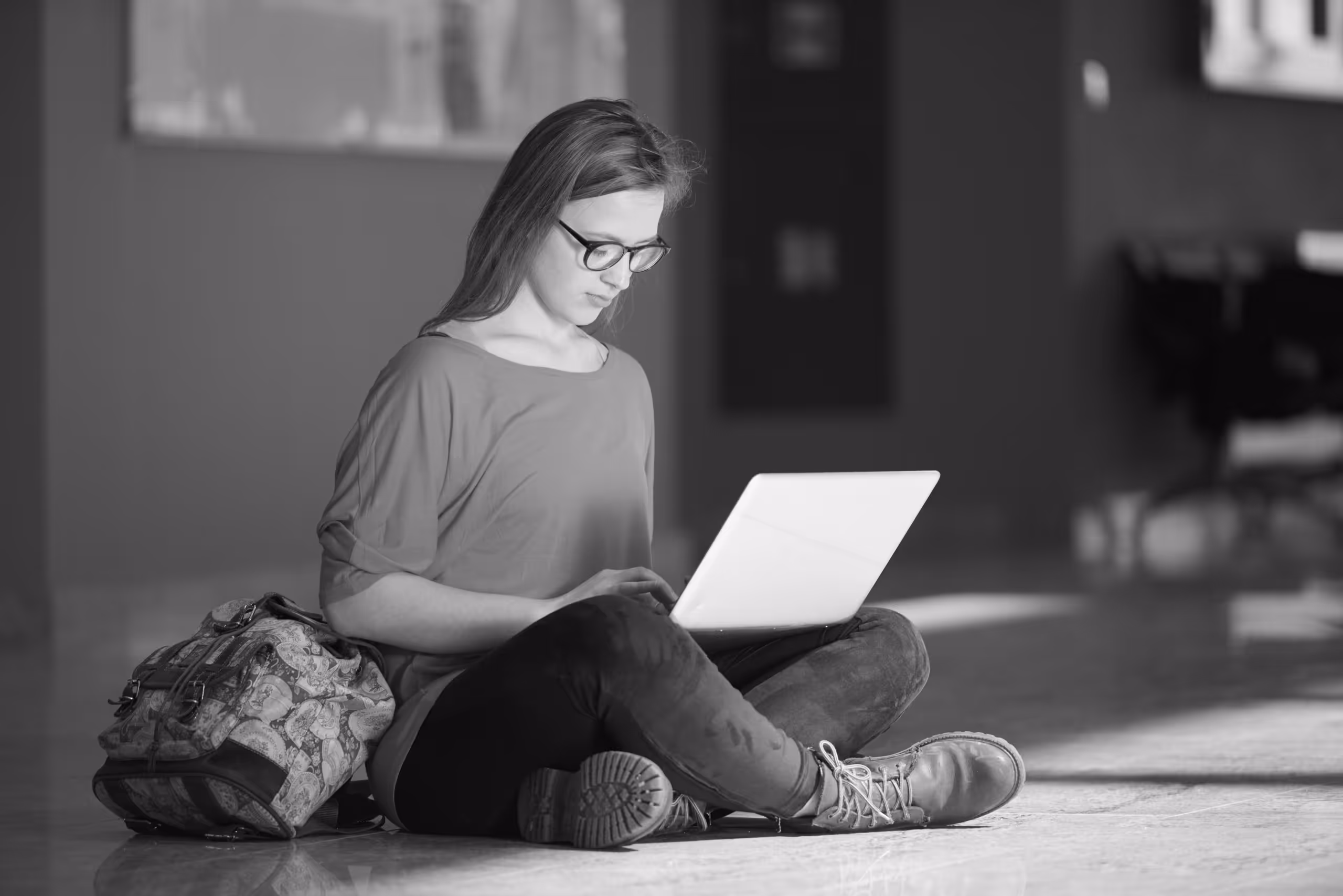 LGBTQ-affirming clinical supervision for therapists image of a person on their laptop