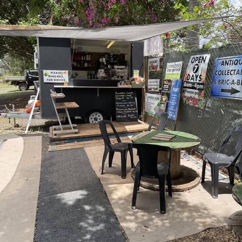 Coffee van and seating outside fruit and veg stall