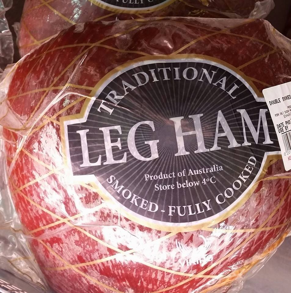 A leg of ham wrapped in plastic packaging