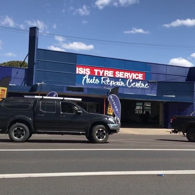 Frontage of Isis Tyre Service Shop with Car in front of store.