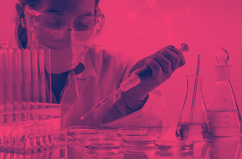 A scientist pipetting