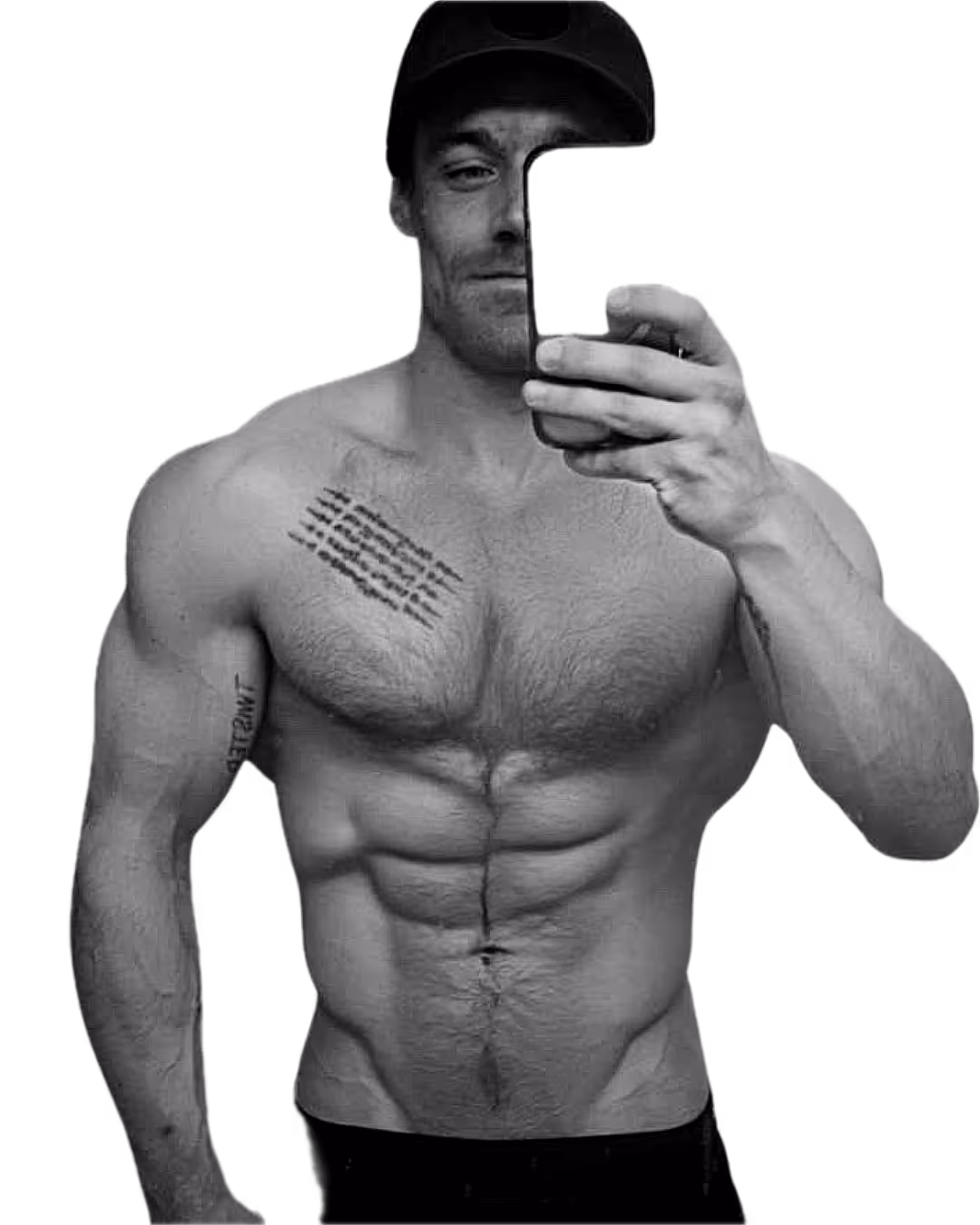 Alex taking a shirtless mirror selfie with tattoos on his chest and arms, wearing black pants.