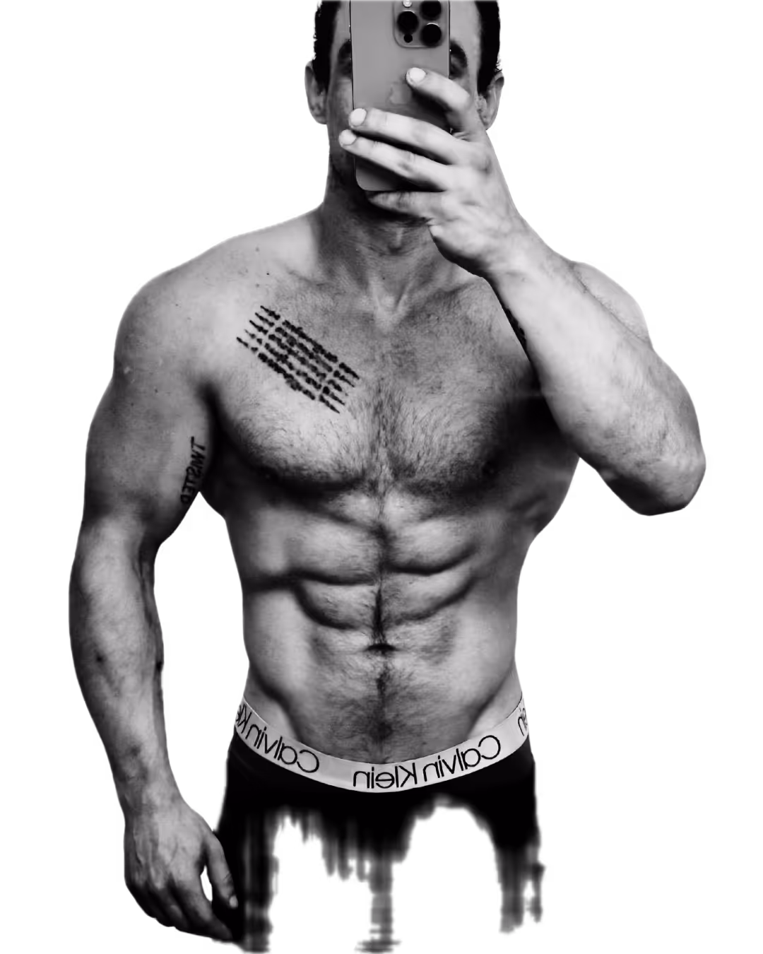 Muscular shirtless man with visible chest and arm tattoos taking a selfie with a smartphone covering his face.