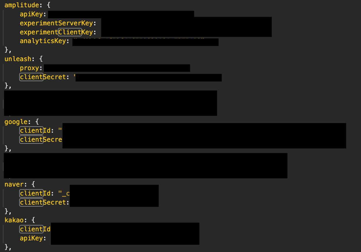 Code snippet showing configuration file structure with redacted API keys/secrets for various services.