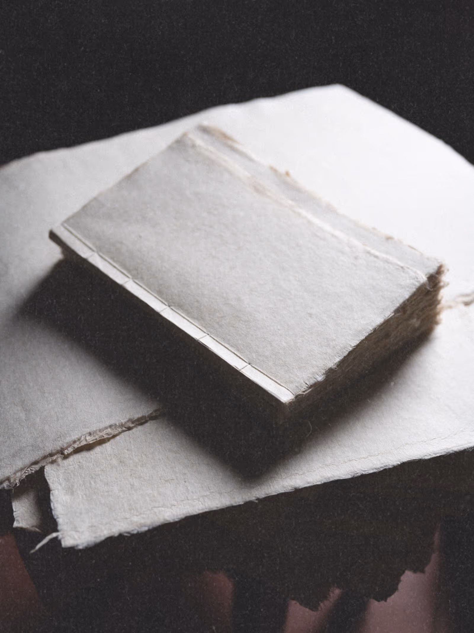Handmade Dao paper journal with textured soft white cover and hand-stitched binding
