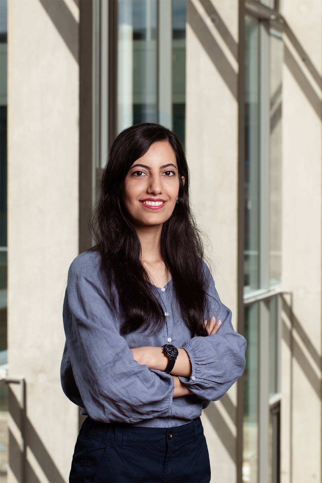 A businesswoman is looking confident into the camera
