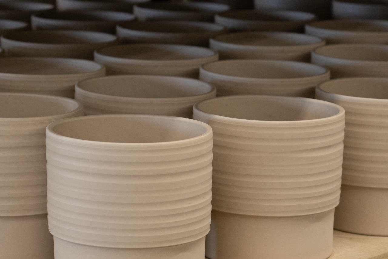 Many ceramic jars drying to be glazed after