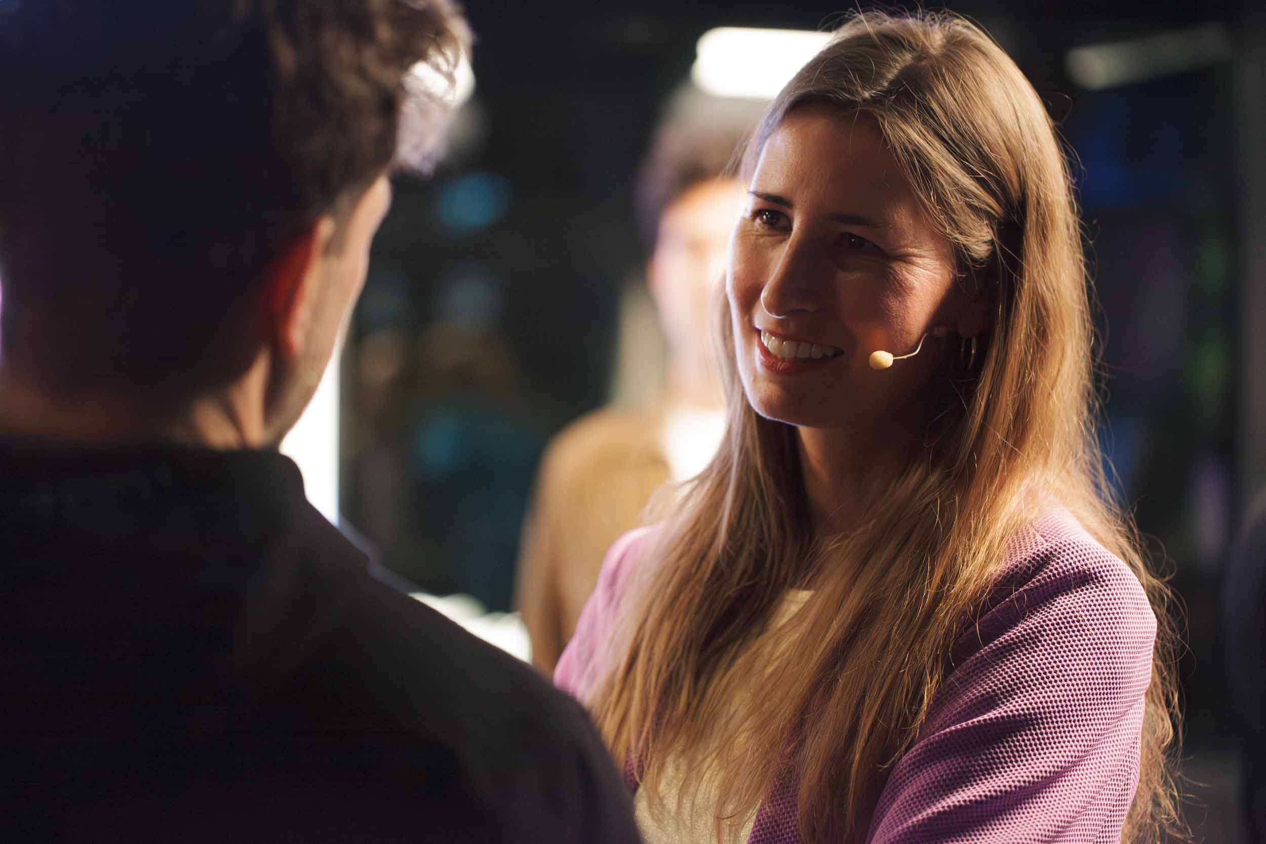 A woman is talking to a man