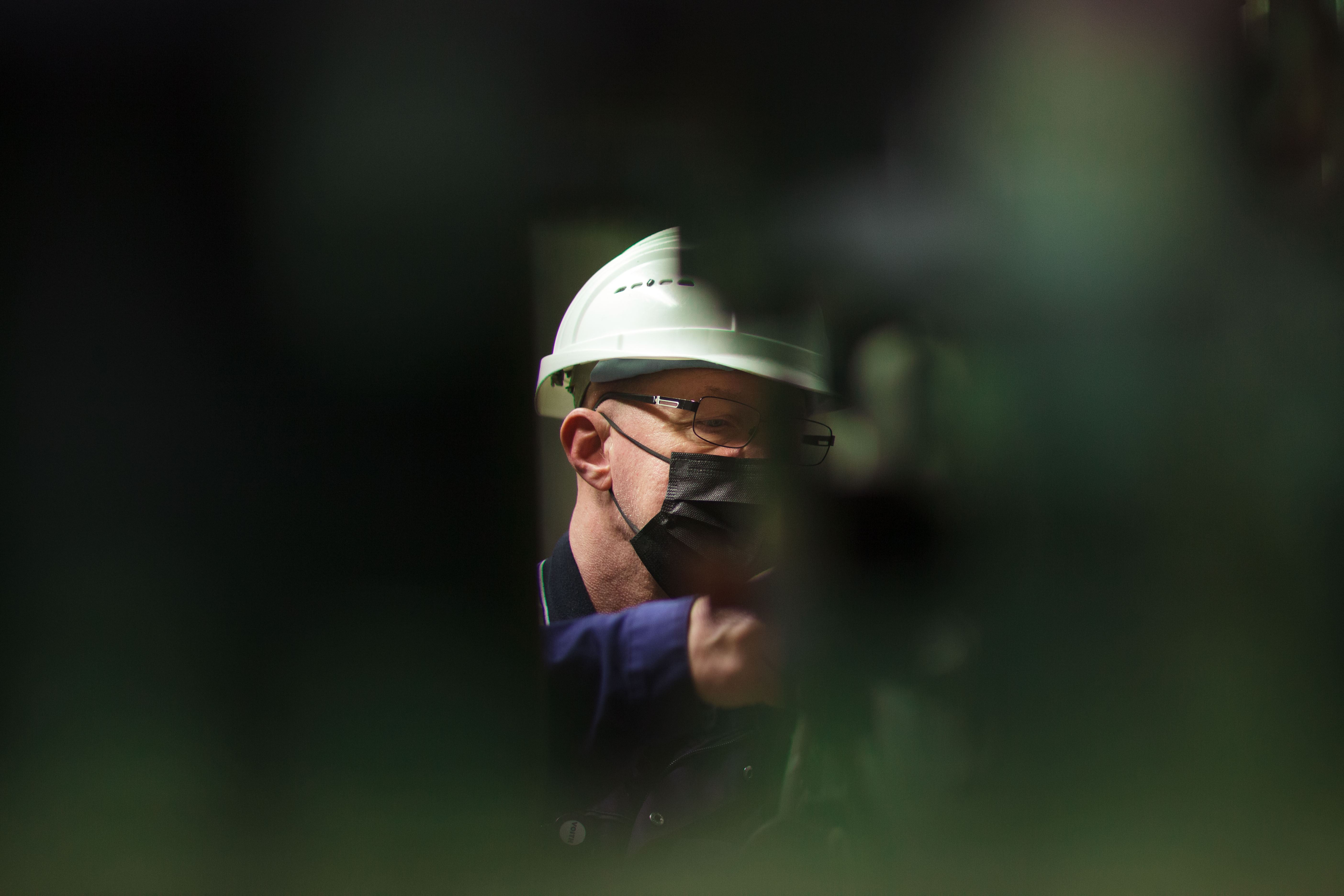 A woman is talking to a man