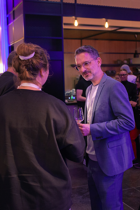 A woman is talking to a man