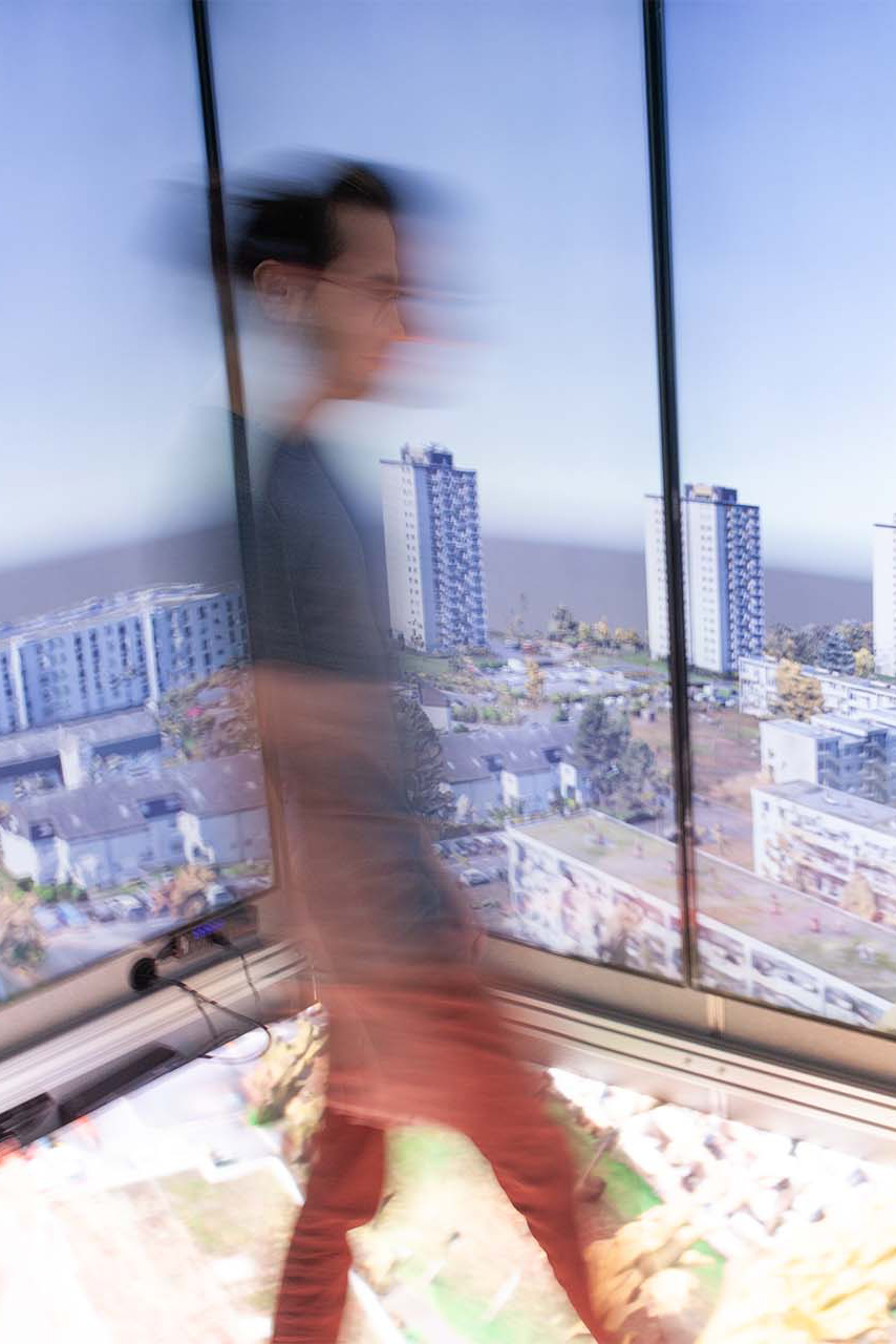 A man walking inside a video cave in Mainz, Germany
