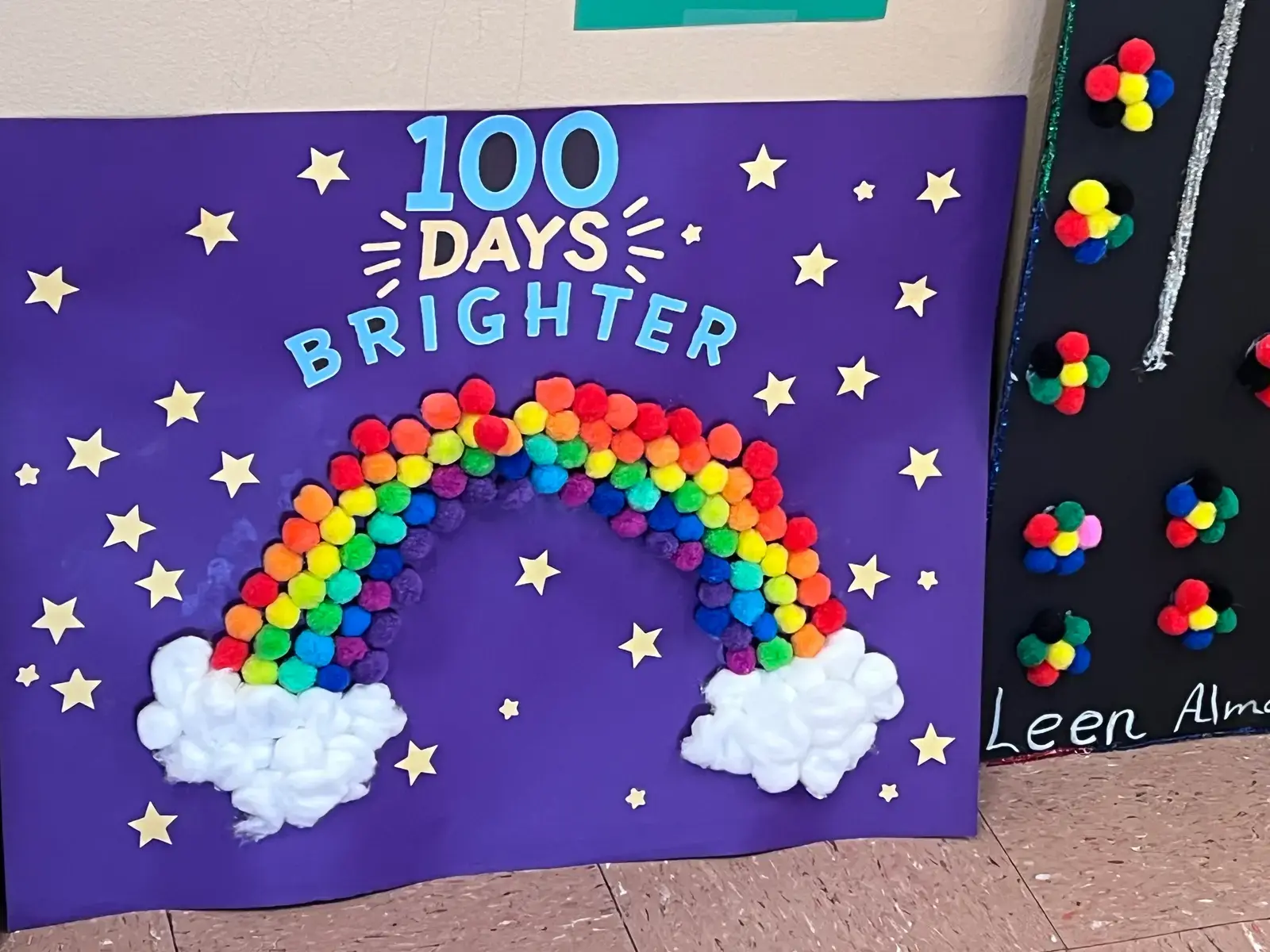 100 Days Brighter bulletin board with pom-pom rainbow and stars