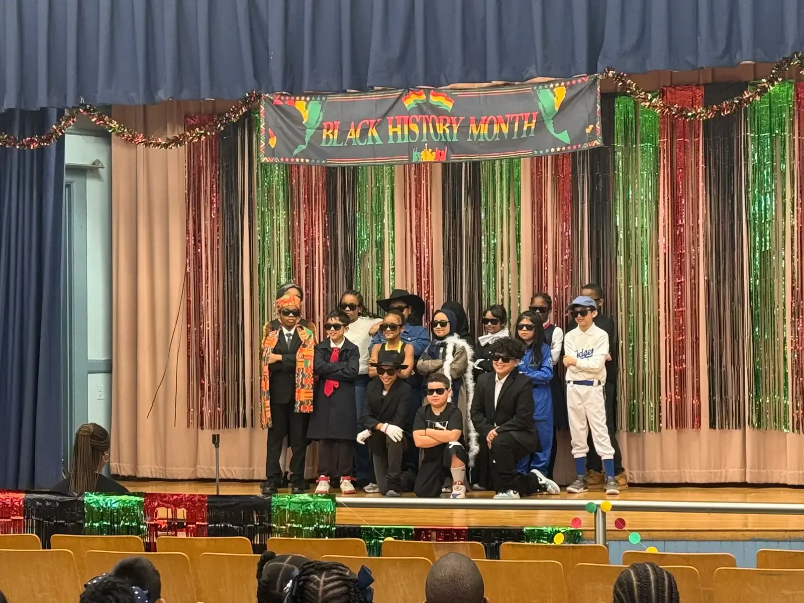 Students in costume perform in a Black History Month school play
