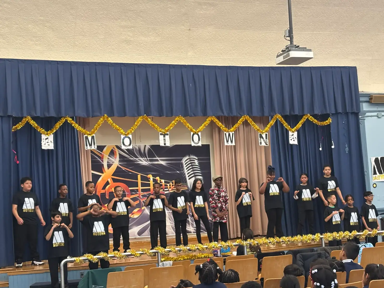 Students performing in a school Motown themed stage show