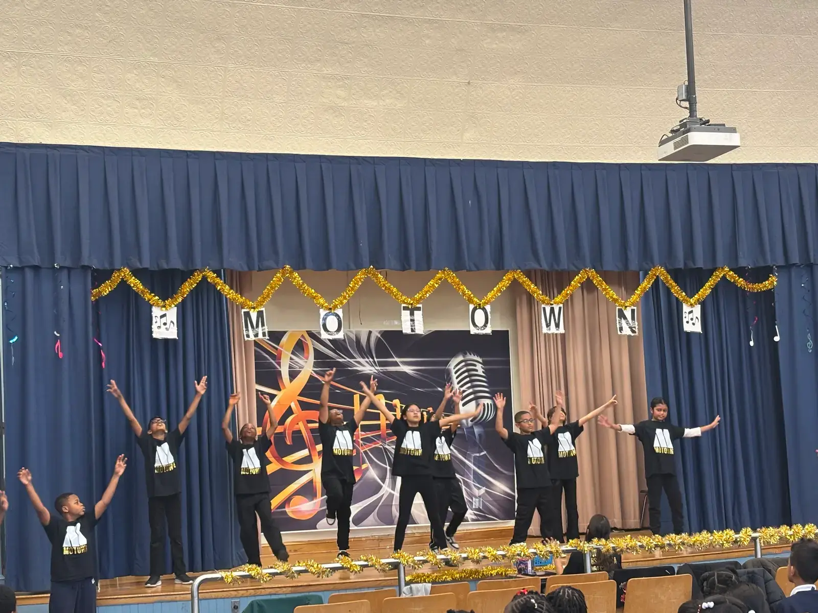 Students performing in a school Motown themed stage show