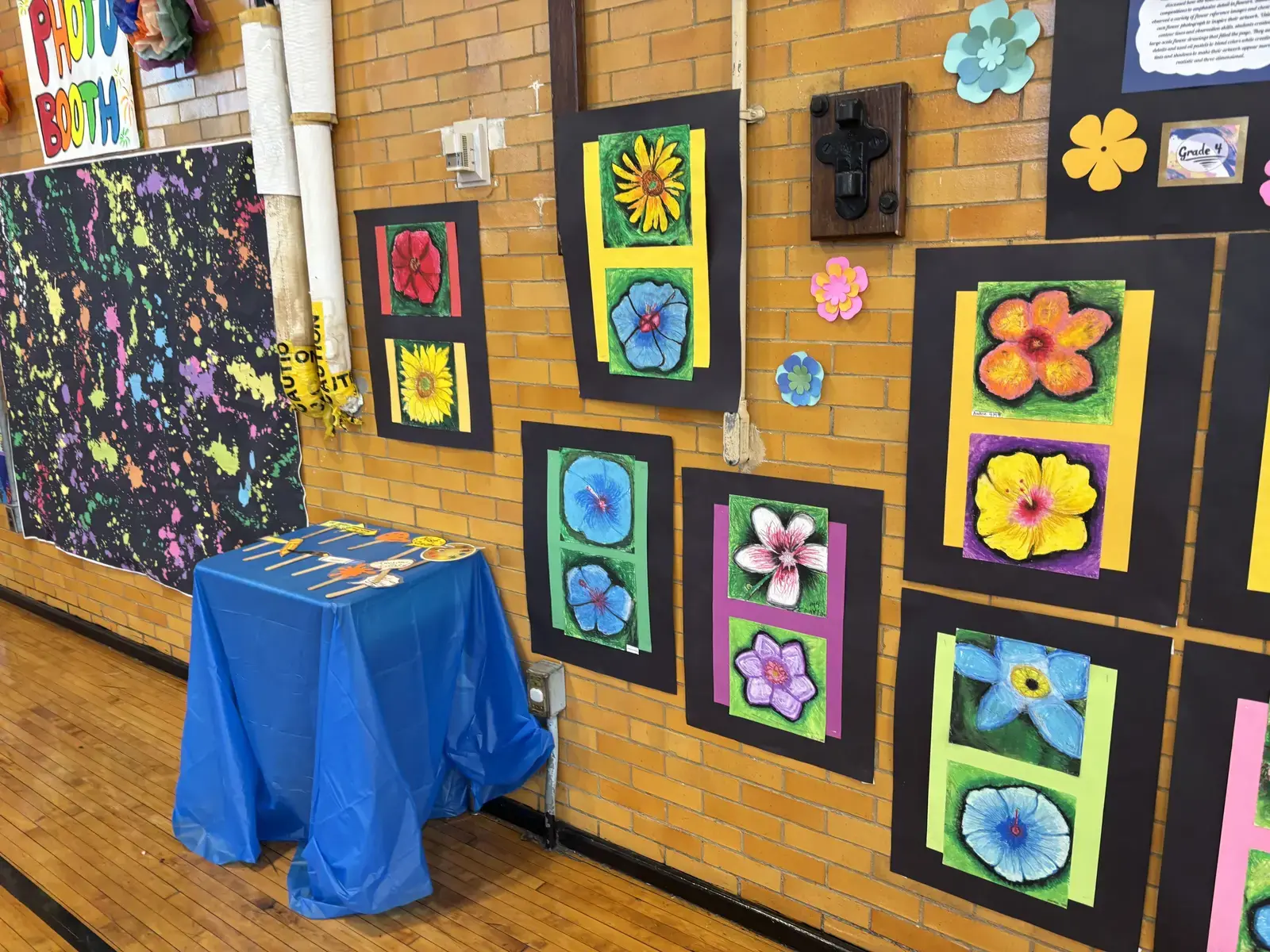 Grade 4 student flower artwork displayed at school art show
