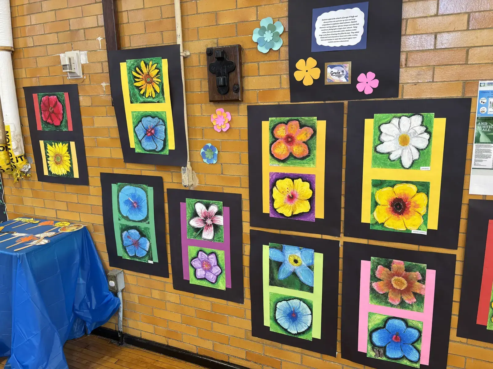 Grade 4 student flower artwork displayed on school hallway wall