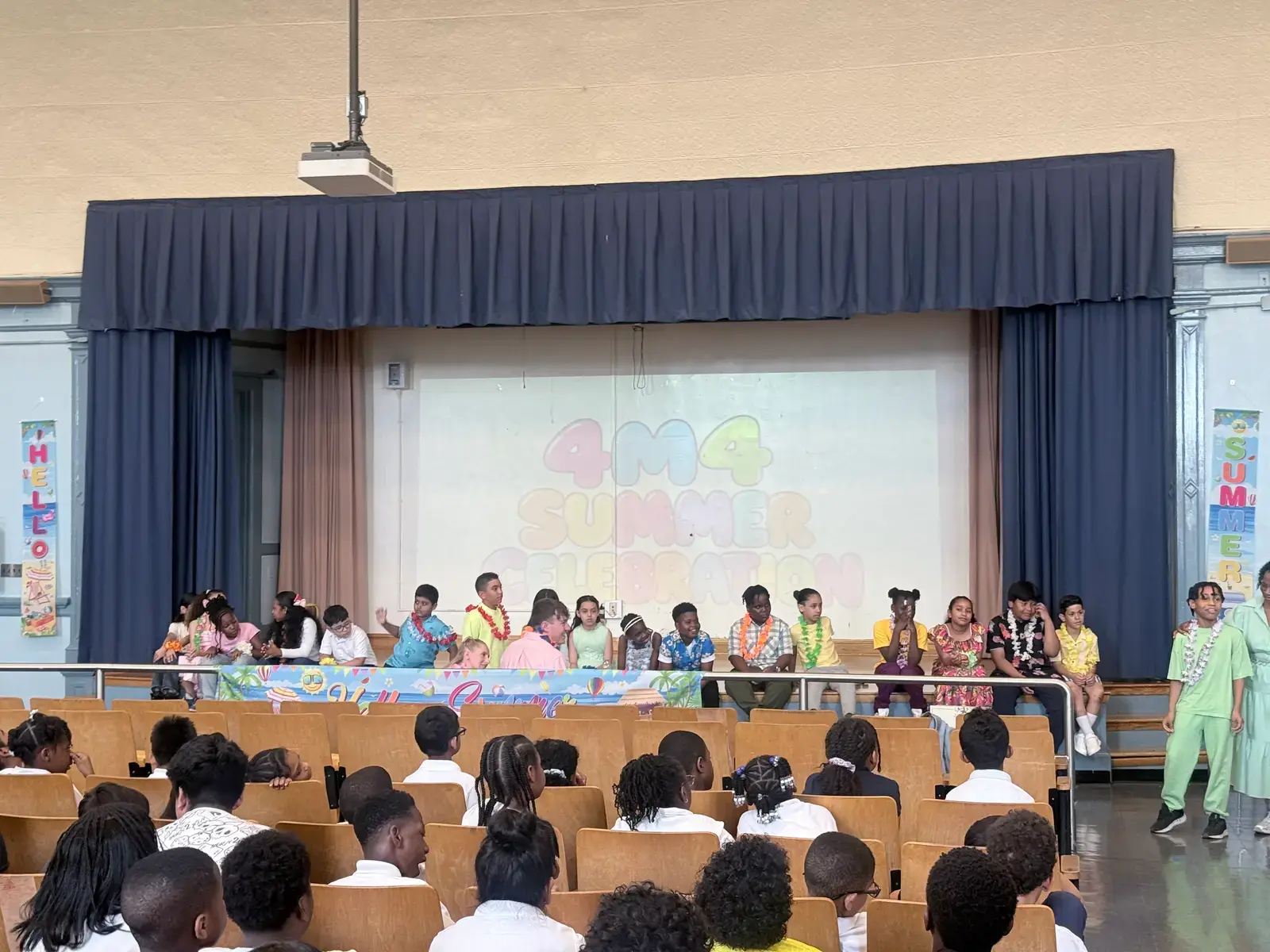 Students on stage at class 4M4 summer celebration assembly