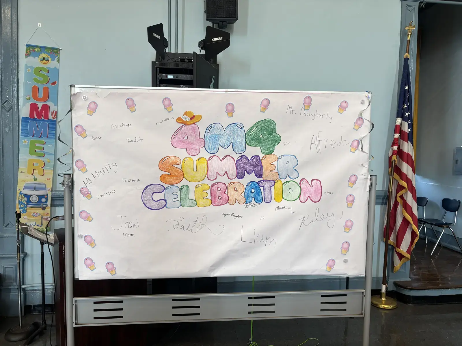 Student-signed banner reading 4M4 Summer Celebration with colorful lettering