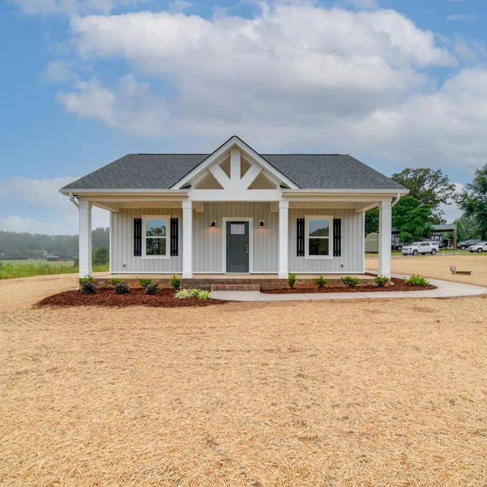 Modern farmhouse exterior with white board and batten siding and covered front porch