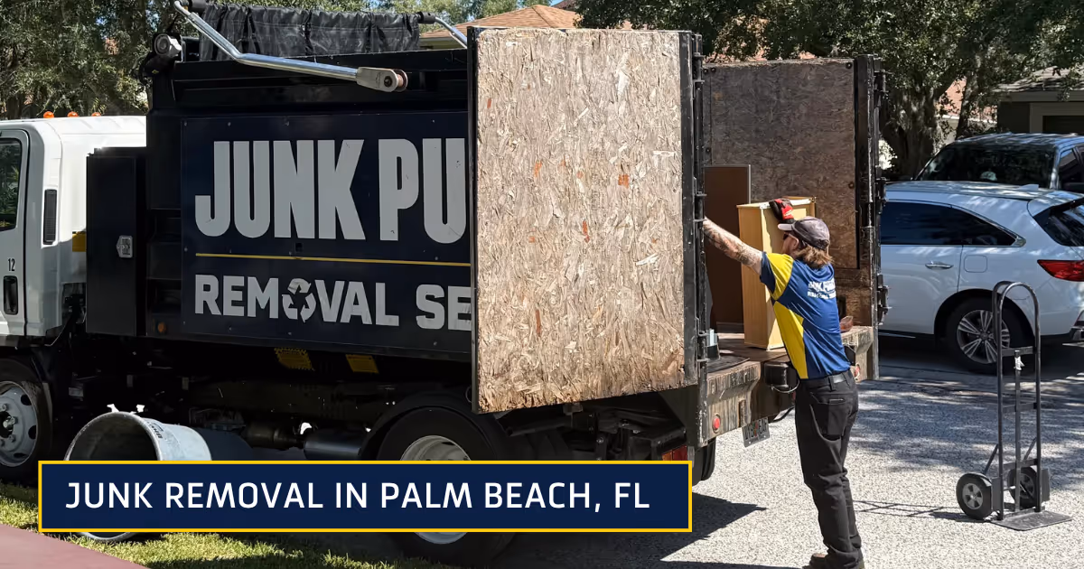 Junk Punks removing junk and loading into the back of a junk truck.