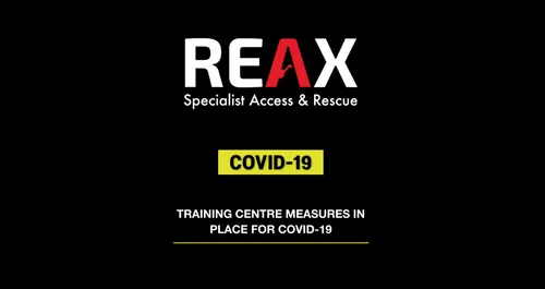 A poster with the REAX logo and COVID 19 in bright yellow