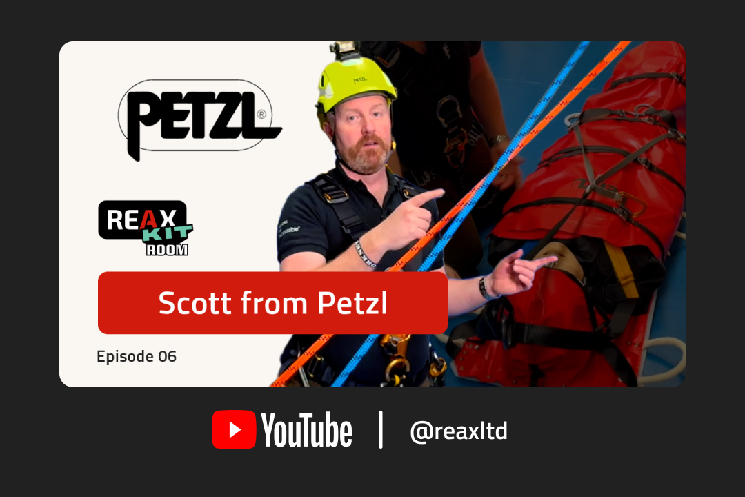 Image of Scott from Petzl wearing a yellow safety helmet pointing towards the Petzl nest rescue device