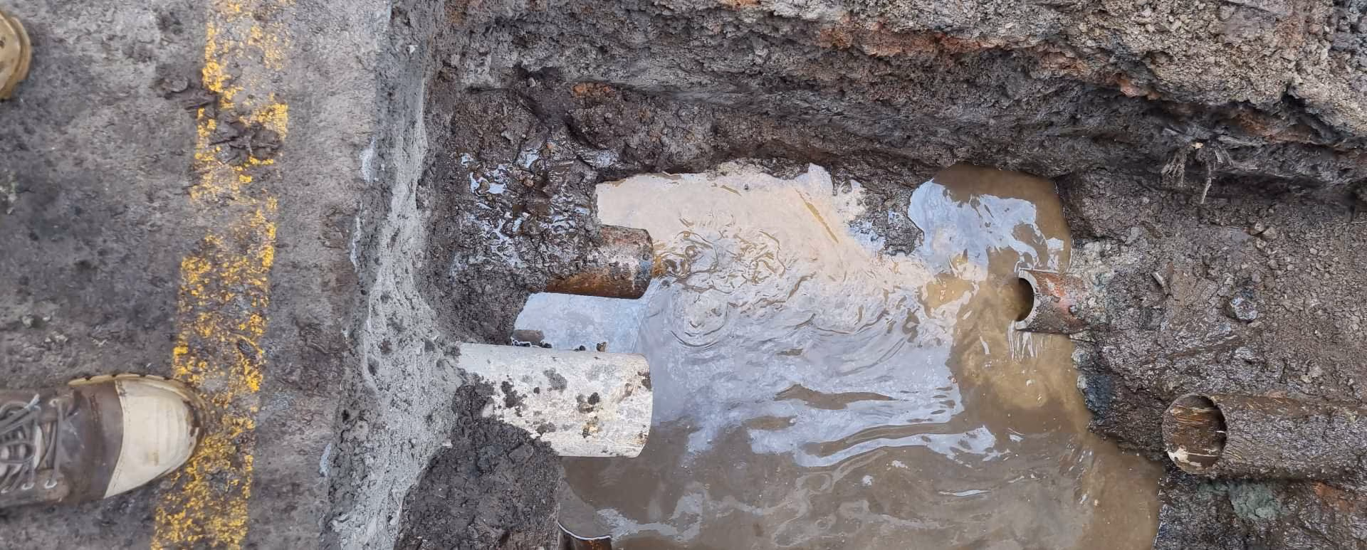 Open stormwater catchpit with several drainage pipe connections