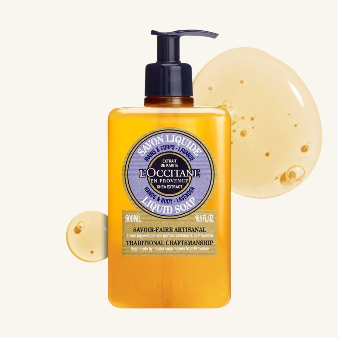 A clear plastic refill pouch of liquid soap labeled L'OCCITANE Shea Hands & Body Lavender, shown with a lavender scent indicator.