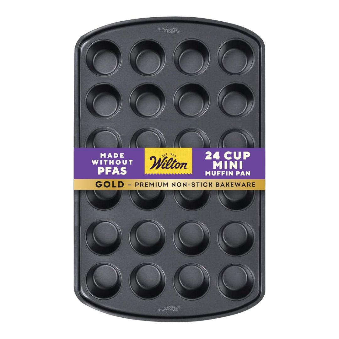 A silver, non-stick mini muffin and cupcake pan with 24 round cavities, shown on a plain background.