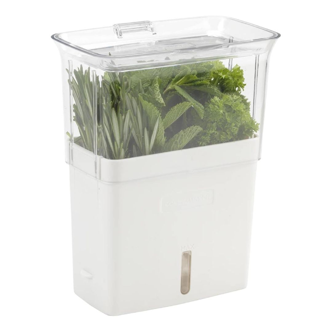 A clear acrylic herb and vegetable storage container with a flip lid, air vents, and removable dividers for refrigerator use.