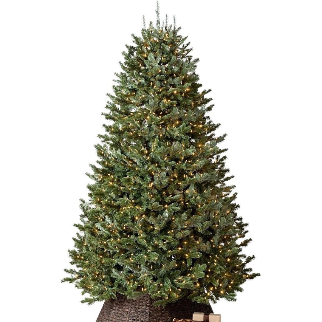 An artificial Fraser fir Christmas tree with realistic green needles and built-in lights, shown indoors.