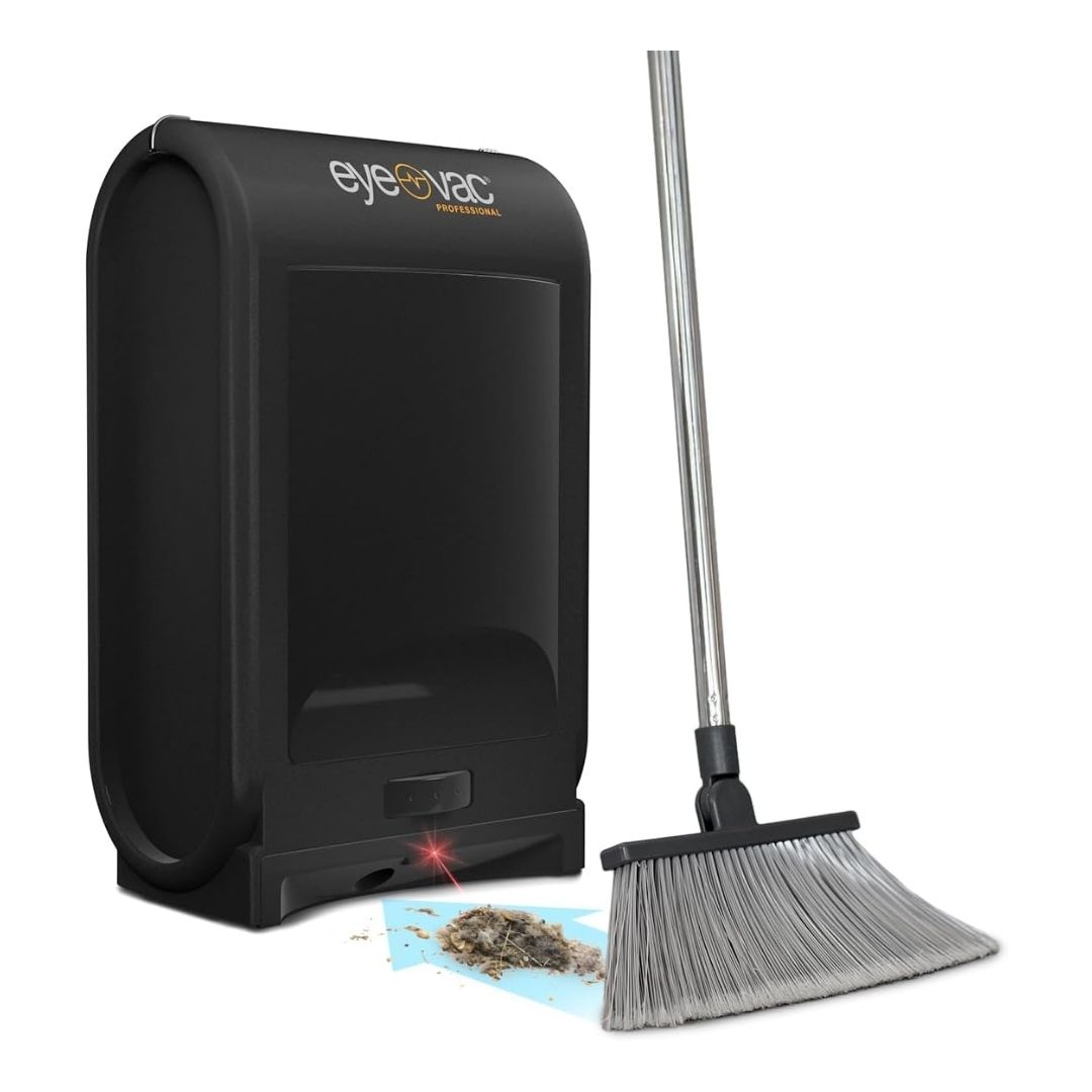 A corded EyeVac Pro Touchless Dustpan, a compact, touchless vacuum with infrared sensors, sits on a kitchen floor.