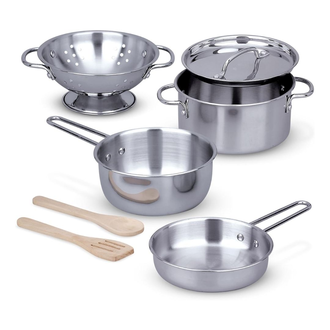 A stainless steel toy kitchen set with a colander, pot with lid, two pans, two wooden utensils, and a metal storage rack.