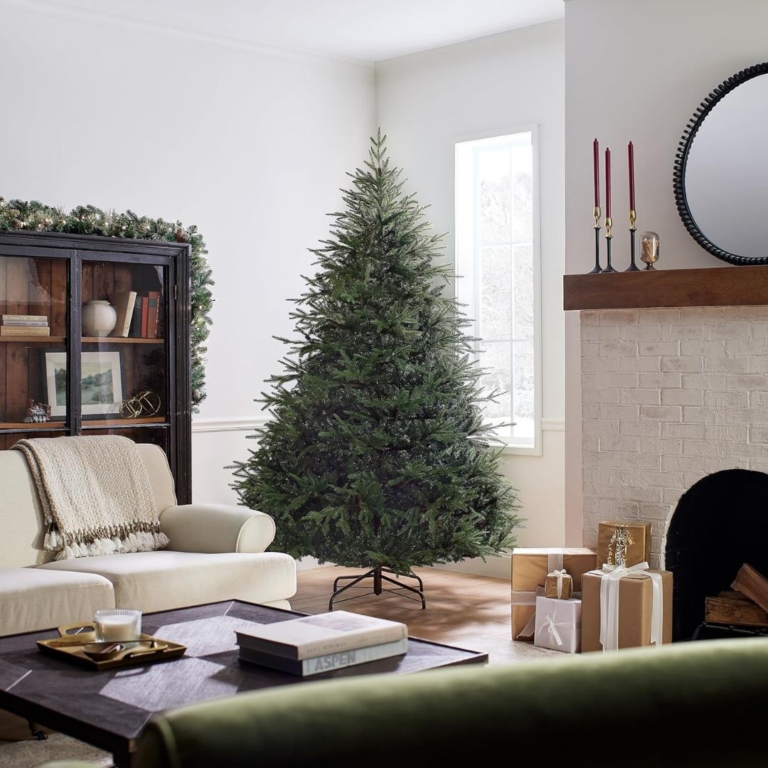 A wide, full-bodied artificial Christmas tree with a natural shape and ample branches for ornaments, unlit and easy to assemble.