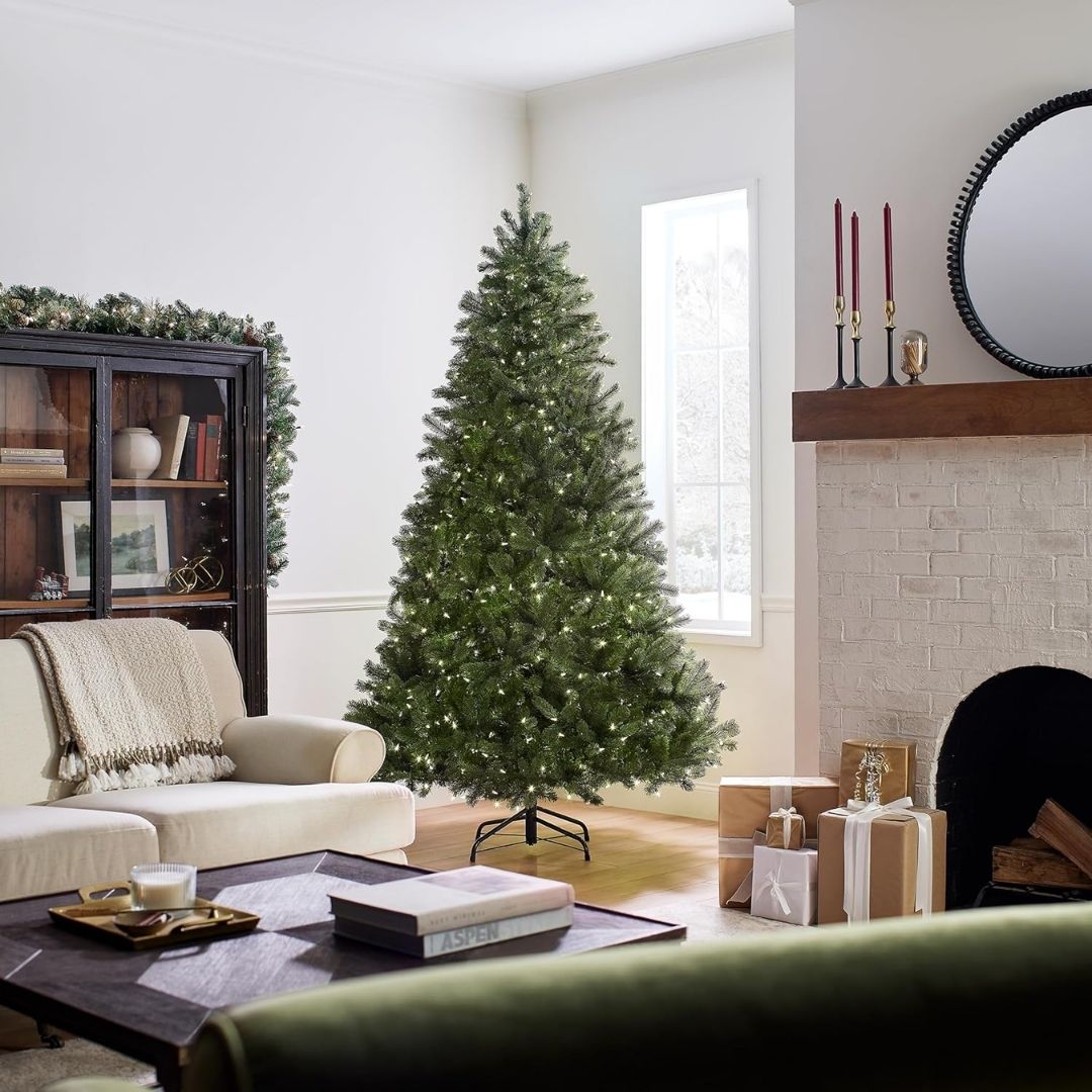 A Downswept Douglas Fir artificial Christmas tree with hinged branches, 'Feel Real' tips, and dual color LED lights.