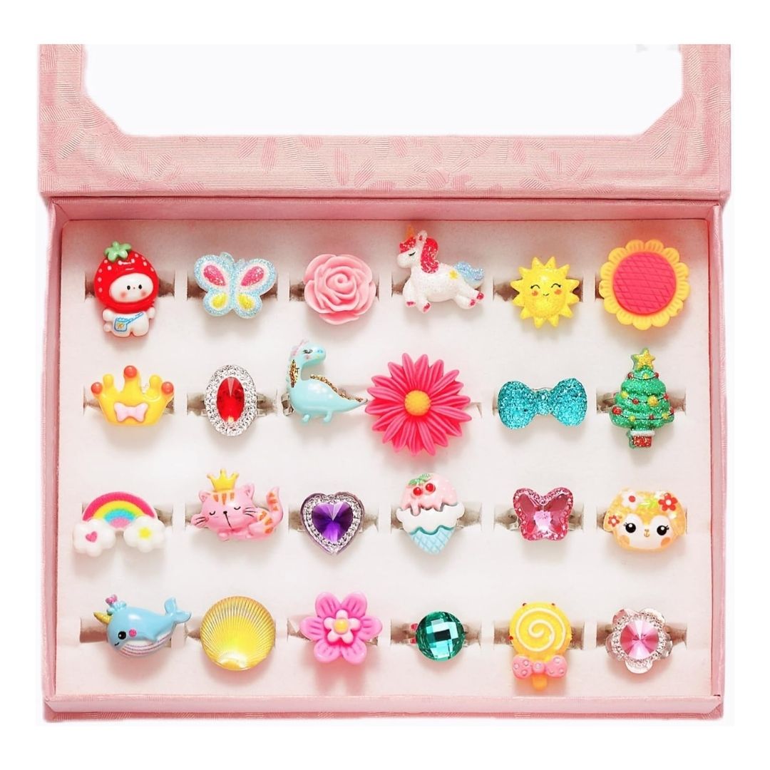 A set of adjustable, jewel-accented metal rings for kids' dress-up and pretend play, displayed in a pink gift box.