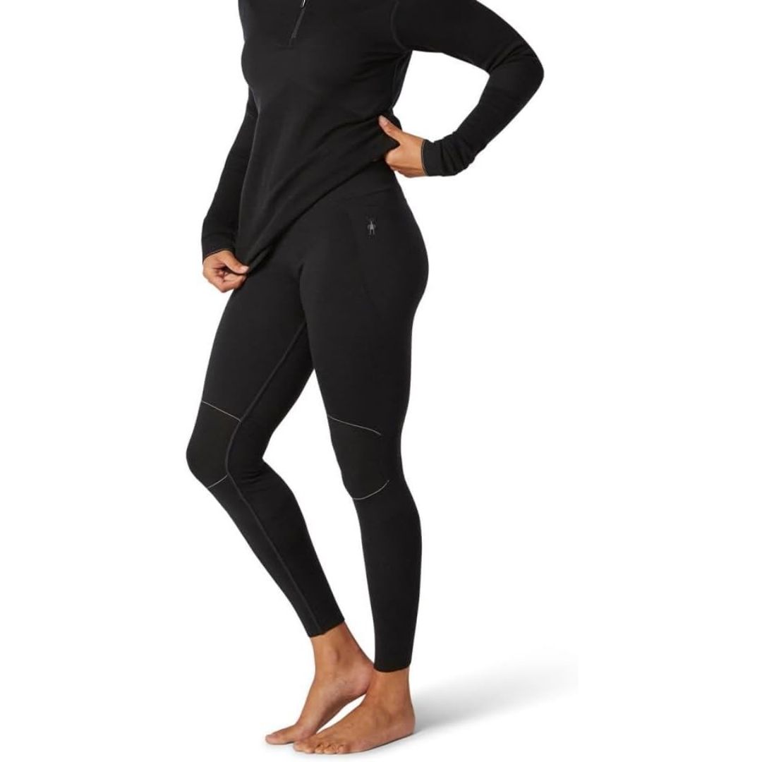 A long-sleeve Merino wool base layer top designed for moisture wicking and odor resistance, ideal for active use under outerwear.