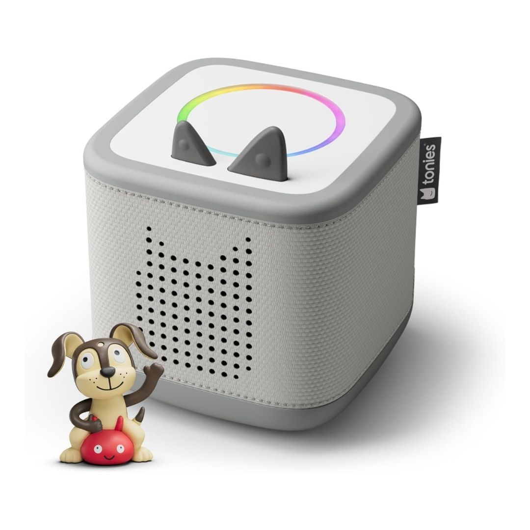 A screen-free audio player with a built-in light, simple controls, and a small animal figurine on top, made for young children.