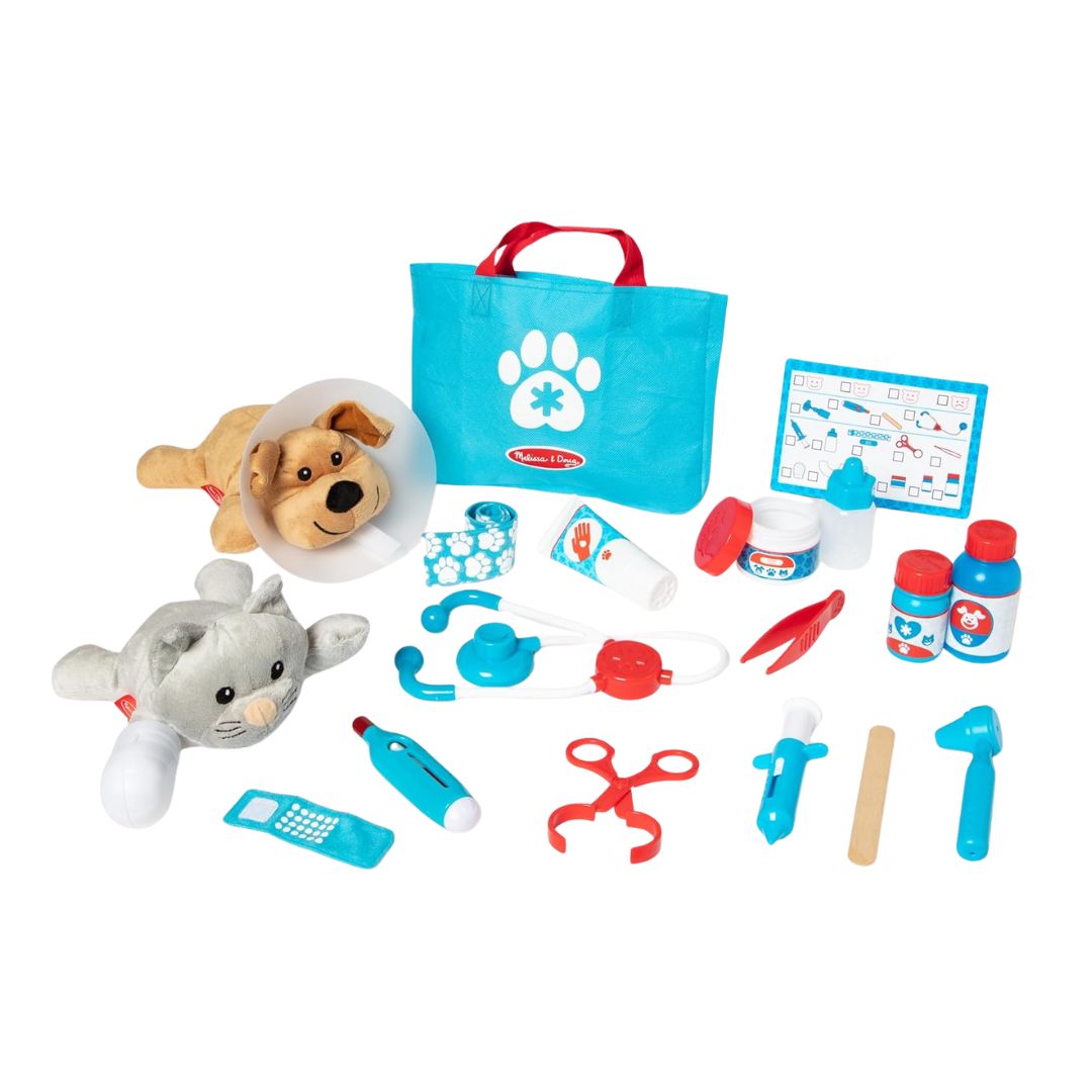 A children's pet vet play set with a plush dog, plush cat, stethoscope, and assorted toy medical accessories.