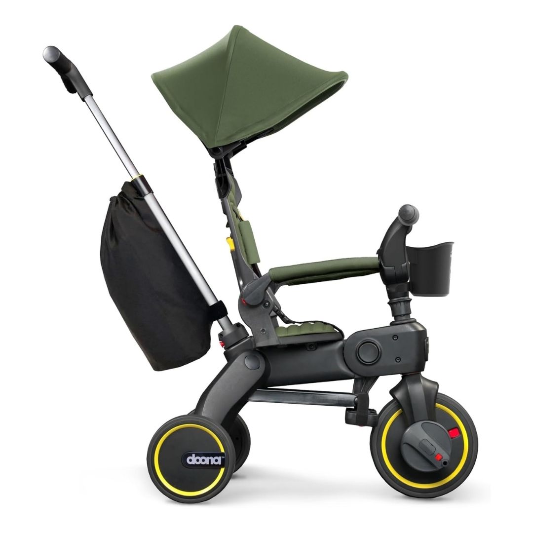 A compact, foldable tricycle with a parent-control bar, reclining backrest, and secure harness, suitable for toddlers.