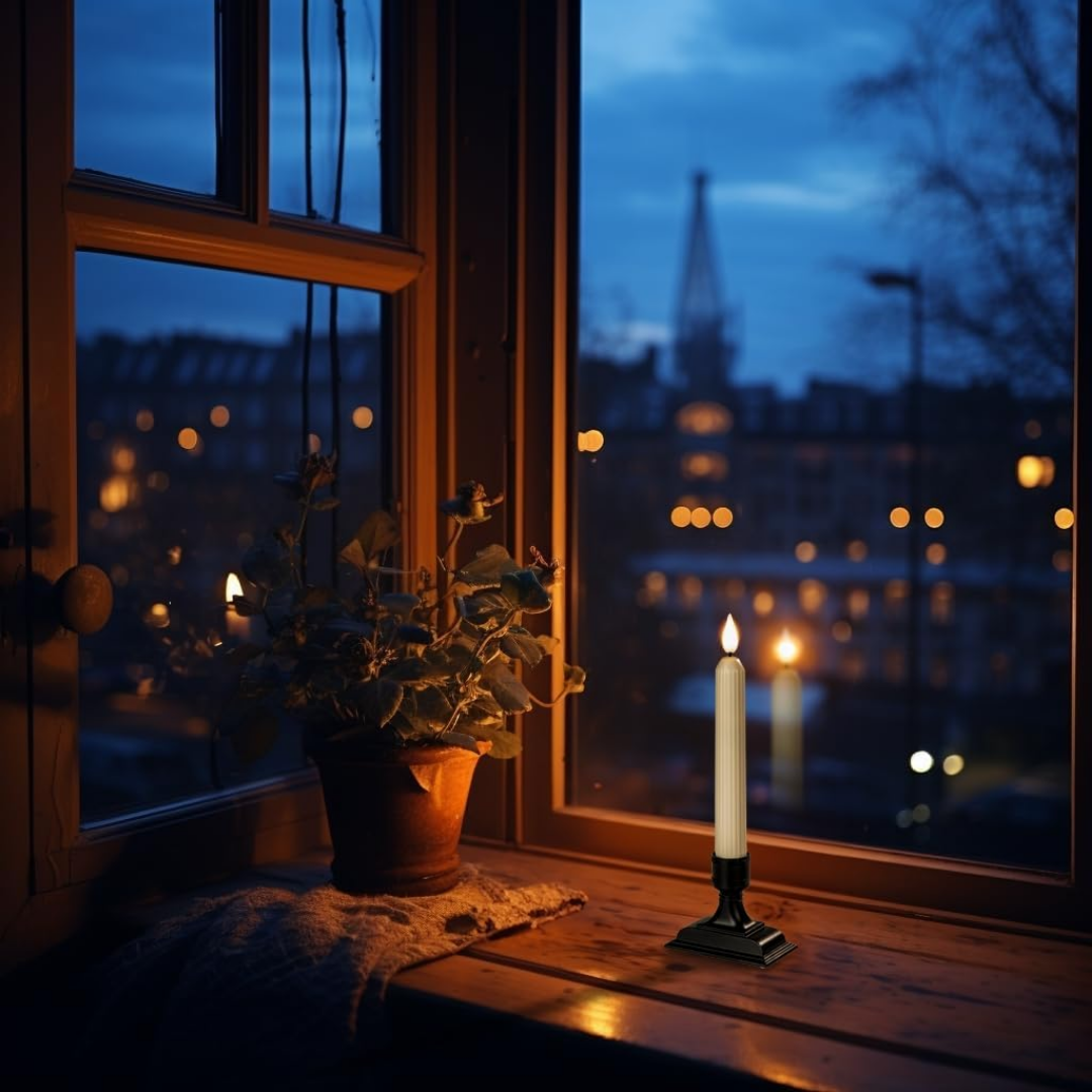 Ivory electric window candles with flickering LED flames and black holders, arranged on a windowsill for holiday decor.