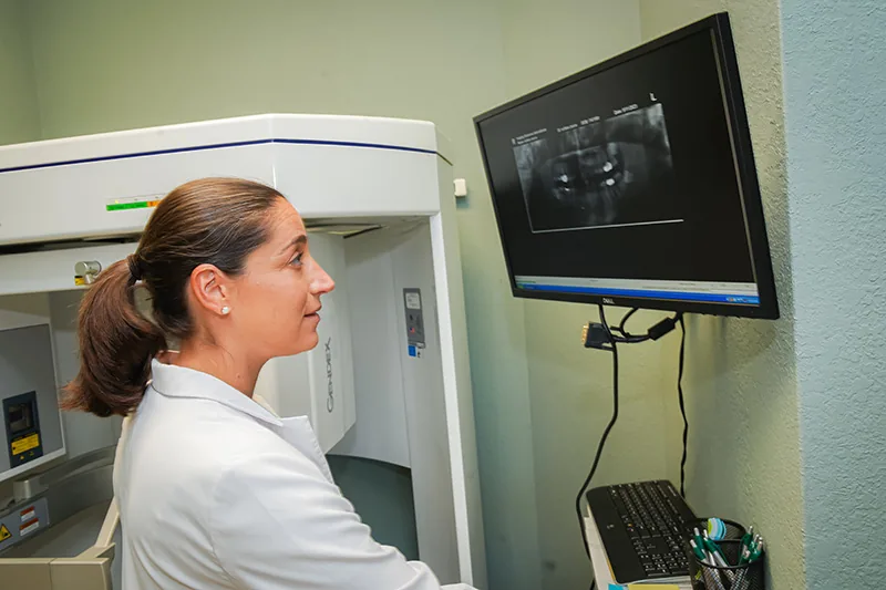 dentist checking digital x-rays