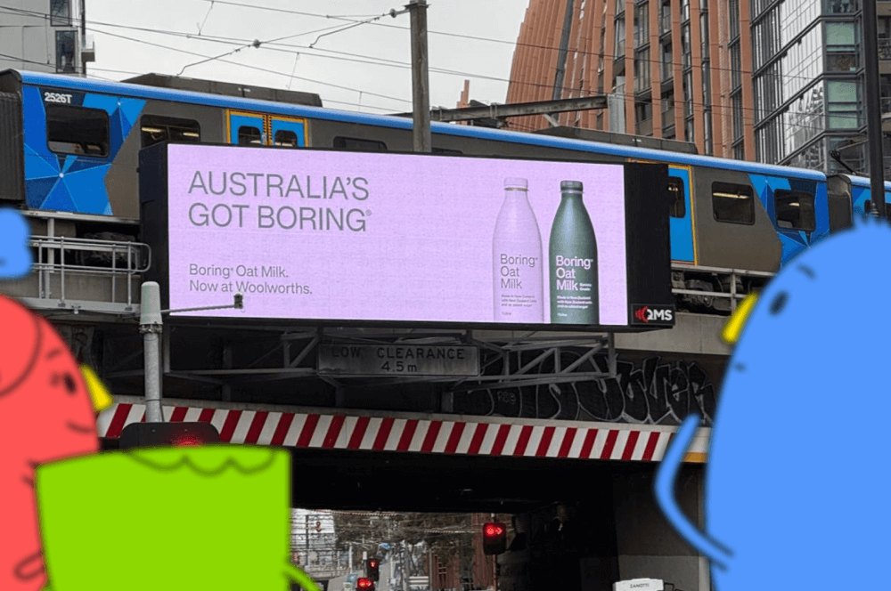 Stickybeak characters looking at Boring Oat Milk Billboard