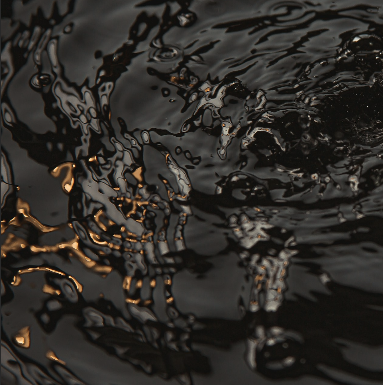 A geometric spiral design with alternating layers of black and white creating a hypnotic visual vortex effect.