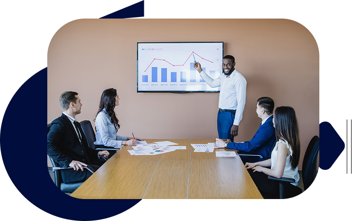 Businessman presenting data chart to colleagues during a meeting in a conference room.