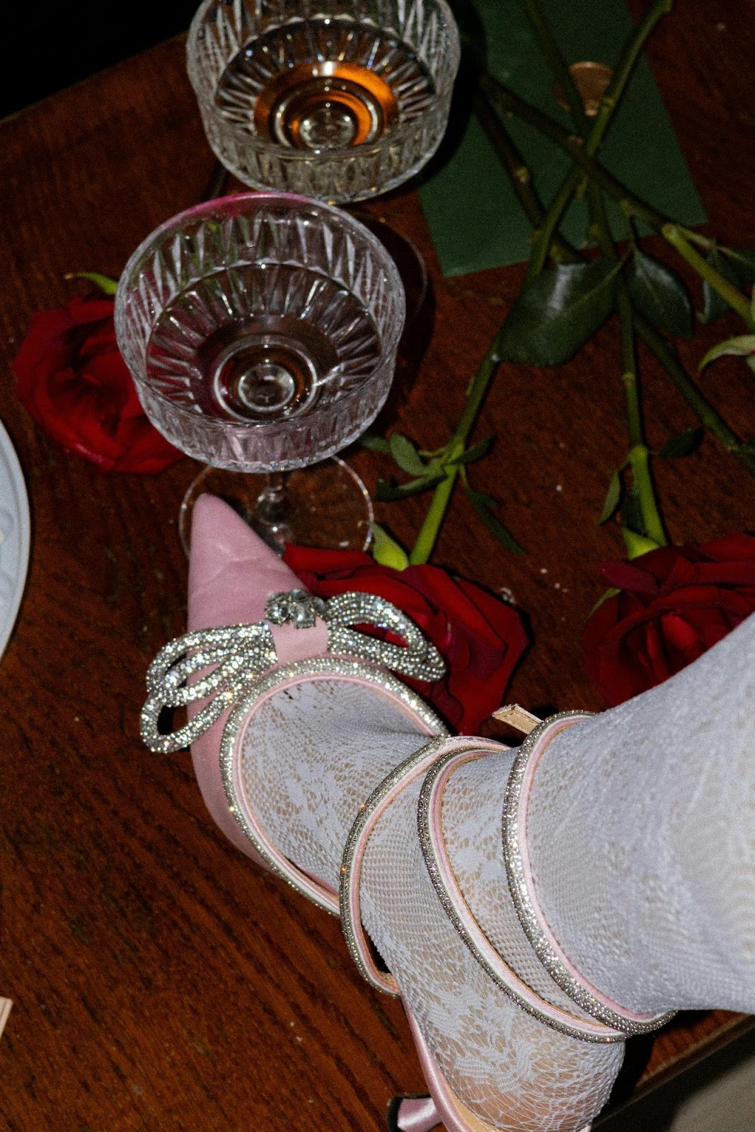 Dazzling silver heels with diamond embellishments on a bridal table