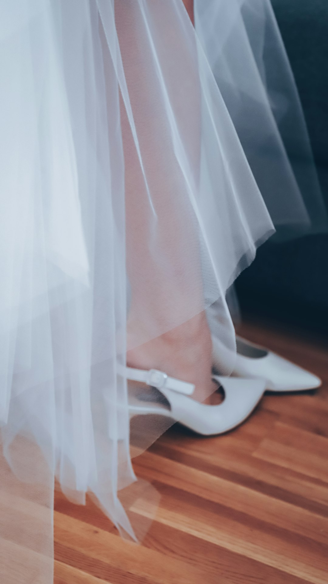 Bride wearing white ballet shoes with lace dress