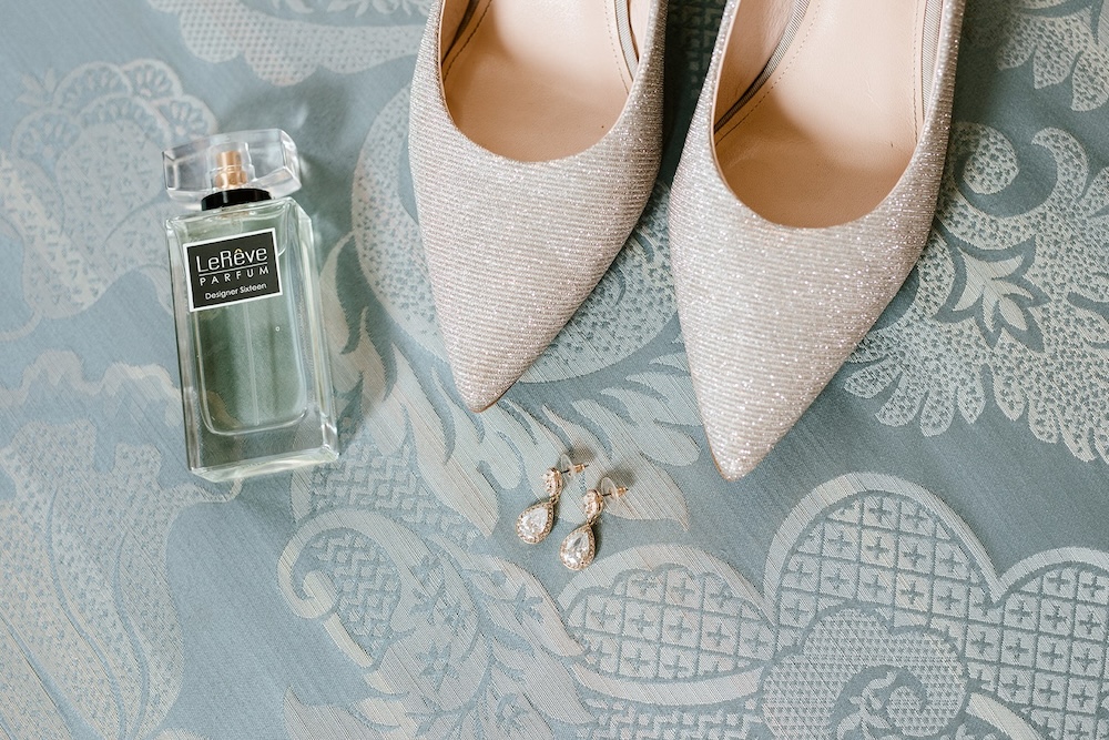 Sparkly white diamond bridal shoes with earings and perfume